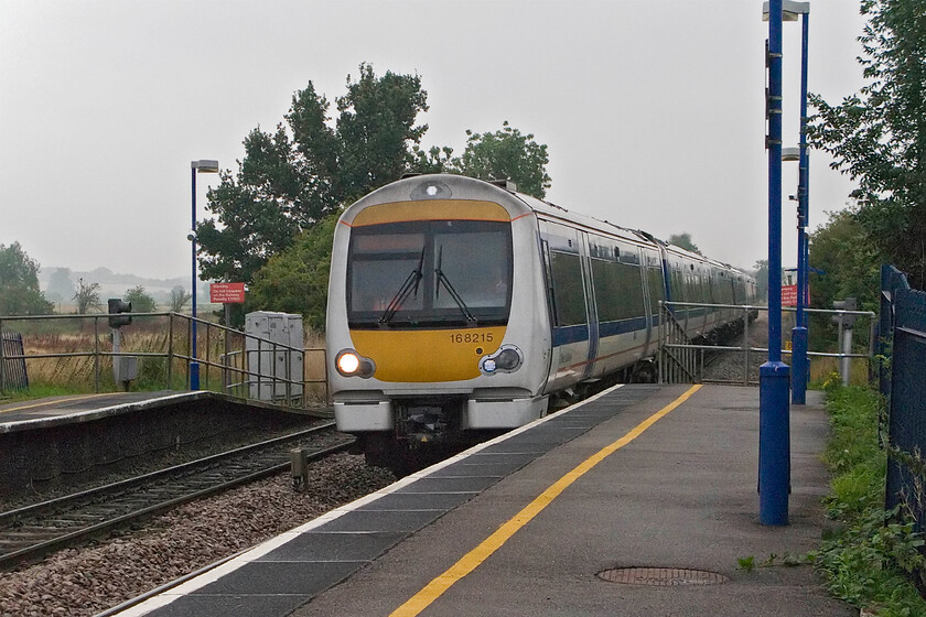 168215, CH 09.45 Birmingham Snow Hill-London Marylebone, King's Sutton station 
 168215 passes through King's Sutton working the 09.45 Birmingham Snow Hill to Marylebone Chiltern service. For August (even if it is very close towards the end of the month) it is a particularly dull and decidedly chilly day. 
 Keywords: 168215 09.45 Birmingham Snow Hill-London Marylebone, King's Sutton station Chiltern Turbo