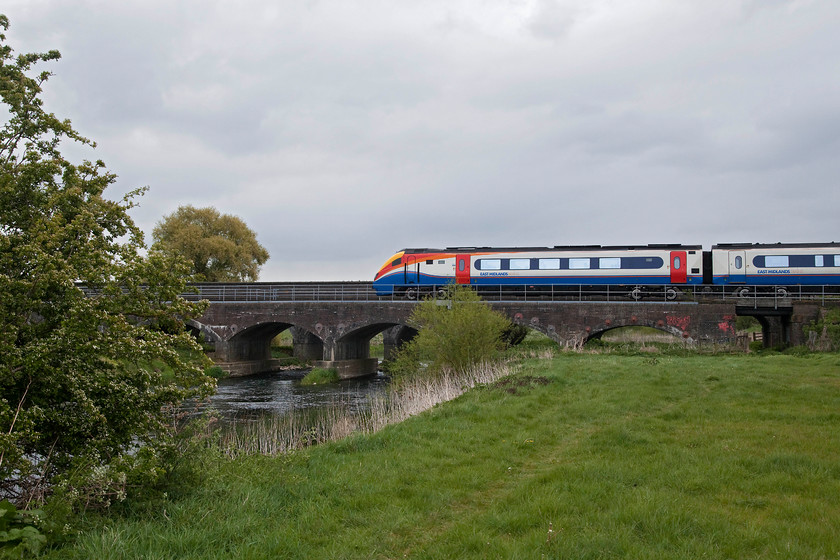 222102, EM 10.29 London St. Pancras-Nottingham (1D24, RT), Radwell Viaduct TL008569 
 222102 crosses the low Radwell Viaduct that in itself crosses the River Great Ouse in the foreground. The Meridian is working the 10.29 St. Pancras to Nottingham train. The Great Ouse has its source at Syresham near to Silverstone and its mouth is into The Wash at Kings Lyn making it, with a length of 143 miles, one of the UK's longest rivers. 
 Keywords: 222102 1D24 Radwell Viaduct TL008569