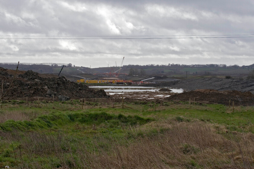 HS2 under-construction, looking SE from SP468528 
 Whilst I am a fan of HS2 and of its now curtailed northern arms, when I see the enormous impact on the landscape needed for its construction I do wince a little. I suppose that the long-term benefits have to be taken into account and hopefully they will trump the shorter-term issues but I am not too sure that local residents will agree. This view is looking southeast from a point where the line will run in a few years near the villages of Upper and Lower Boddington. 
 Keywords: HS2 under-construction looking SE from SP468528