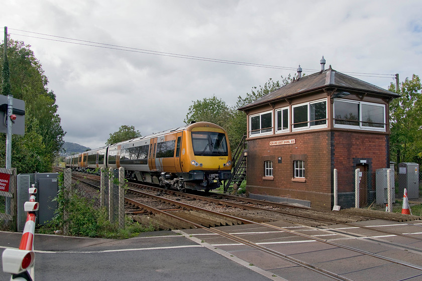 170512 & 170507, LN 11.39 Hereford-Worcester Foregate Street (1M63, 2L), Newland East level crossing 
 A pair of cClass 170s made up of 170512 and 170507 pass Newland East signal box working the 11.39 Hereford to Worcester Foregate Street. The box is a classic type 7A Great Western structure built in 1900. It is shame that its replacement UPVC windows have not been more sympathetically fabricated to replicate the original glazing pattern. There was once a station here named Newland Halt that closed in April 1965. It was a split platform affair with timber platforms located either side of the level crossing. The down platform was located where the tree is to the left of this image whilst the up platform was behind me to the right. 
 Keywords: 170512 170507 11.39 Hereford-Worcester Foregate Street 1M63 Newland East level crossing