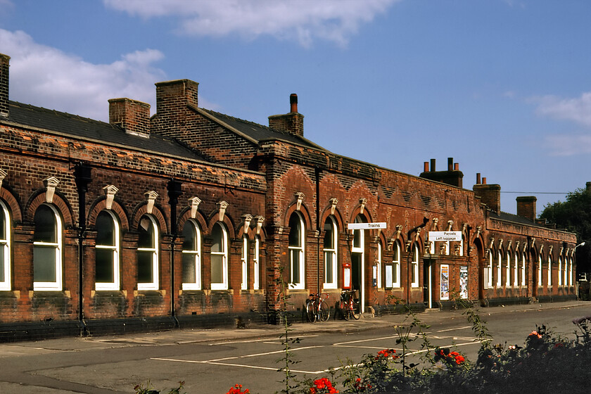 Frontage, March station 
 The frontage of March station is quite impressive for what is, after all, a fairly small Fenland town. In Gordon Biddles Victorian Stations book (David & Charles; 1973) there is a photograph of the frontage with its now removed impressive V-patterened awning the position of which can be seen in the brickwork above the large windows in this 1981 image. The station was opened in 1847 once being a major junction where a number of lines and routes converged with it once having seven platforms! 
 Keywords: Frontage, March station