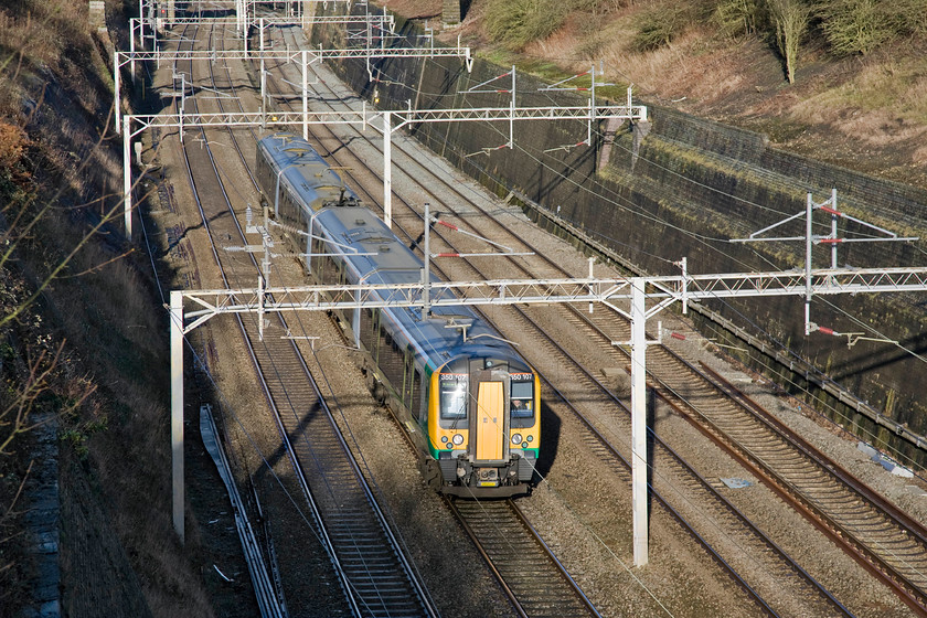 350107, LM 09.02 Crewe-London Euston (1U24), Roade cutting 
 London Midland's 350107 passes through Roade cutting on the up fast line working the 09.02 Crewe to Euston 1U24 service. These services make very slow progress on leaving Crewe travelling all stations via Alsager to Stoke and then to Stafford and back to the WCML again at Colwich. From Rugby, the services then run fast to London with a stop at Milton Keynes only. 
 Keywords: 350107 09.02 Crewe-London Euston 1U24 Roade cutting