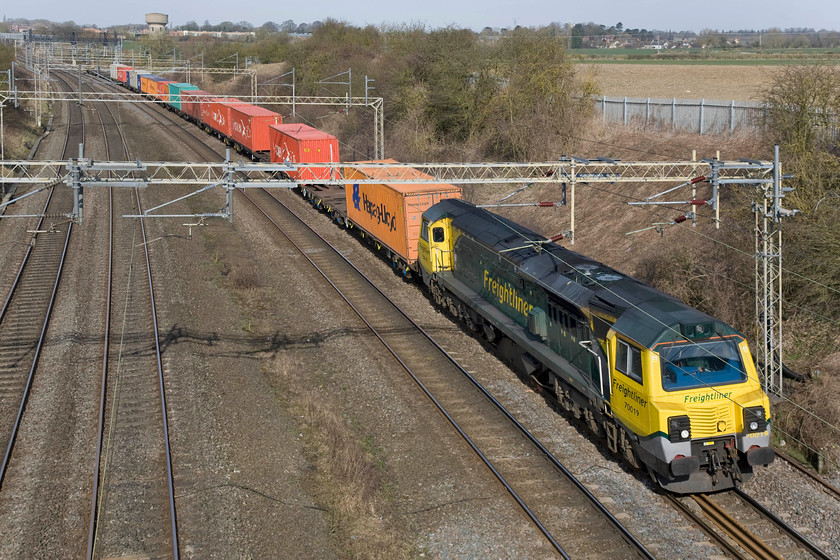 70019, 08.15 Crewe Basford Hall-Southampton (4O29) (Diverted becuase of`Harbury landslip), Victoria bridge 
 An unusual working on the southern WCML is the 4O29 08.15 Crewe Basford Hall to Southampton Freightliner, on this day hauled by 70019 doing its best to shatter the peace and quiet of the Northamptonshire countryside. The reason for the diversion was the closure of the Chiltern line that this service would normally have taken from Birmingham to Oxford. The closure was because of a major landslip in Harbury cutting that closed the mainline between Leamington and Banbury for some weeks. 
 Keywords: 70019, 08.15 Crewe Basford Hall-Southampton (4O29) (Diverted becuase of`Harbury landslip), Victoria bridge