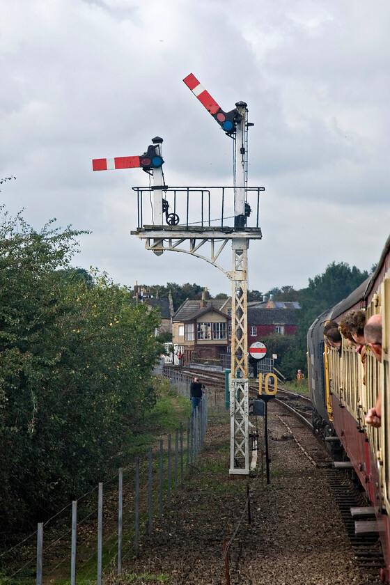 Wansford home signal, from the 10.50 Peterborough Nene Valley-Wansford (2M45), Wansford 
 50026 'Indomitable' slows the 10.50 Peterborough Nene Valley to Wansford gala service on the approach to its destination. The train is passing Wansford's home bracket signal complete with a lower-mounted shunting disc signal. Wansford's signal box can also be seen on the other side of the girder bridge that spans the River Nene. 
 Keywords: Wansford home signal the 10.50 Peterborough Nene Valley-Wansford 2M45 Wansford 50026 'Indomitable'