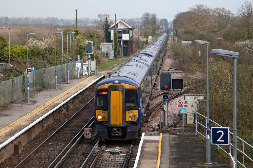 375908, SE 15.17 Ramsgate-London Charing Cross (2W52, RT), Minster station 
 Southeastern's 375908 arrives at Minster staton working the 15.17 Ramsgate to Charing Cross. By now, mid afternoon, the sun had begun to put in an appearance on what had been , up to this stage, a pretty miserable and grey day! Minster is at a triangular junction where the Dover via Deal line diverges from the Canterbury to Ramsgate line. The signal box still remains as can be seen in this picture. 
 Keywords: 375908 2W52 Minster station