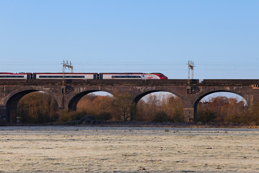 Class 390, VT 08.23 London Euston-Birmingham New Street (9G28, 4L), Haversham SP818425 
 A class 390 passes over Haversham viaduct forming the 08.23 Euston to Birmingham New Street. The viaduct is also known as Wolverton viaduct was built by the London and Birmingham Railway in 1838/9. When the line was quadrupled the viaduct was widened in 1878 with the two sections tied together. The structure is grade II listed. 
 Keywords: Class 390 08.23 London Euston-Birmingham New Street 9G28 Haversham SP818425