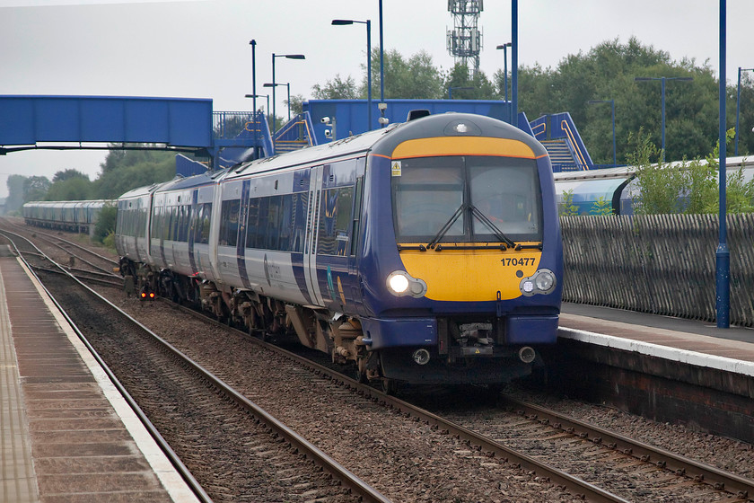 170477, NT 15.02 Scarborough-Sheffield (1J15, 2E) Hatfield & Stainforth station 
 One of Northern's newly acquired class 170s passes through Hatfield and Stainforth station working the Northern 15.02 Scarborough to Sheffield service. 170477 is one of sixteen members of the class that Northern acquired from ScotRail made surplus due to electrification and the arrival of the cascaded former Great Western HST short sets; the procurement of stock on the UK network is such a fickle affair! 
 Keywords: 170477 15.02 Scarborough-Sheffield 1J15 Hatfield & Stainforth station