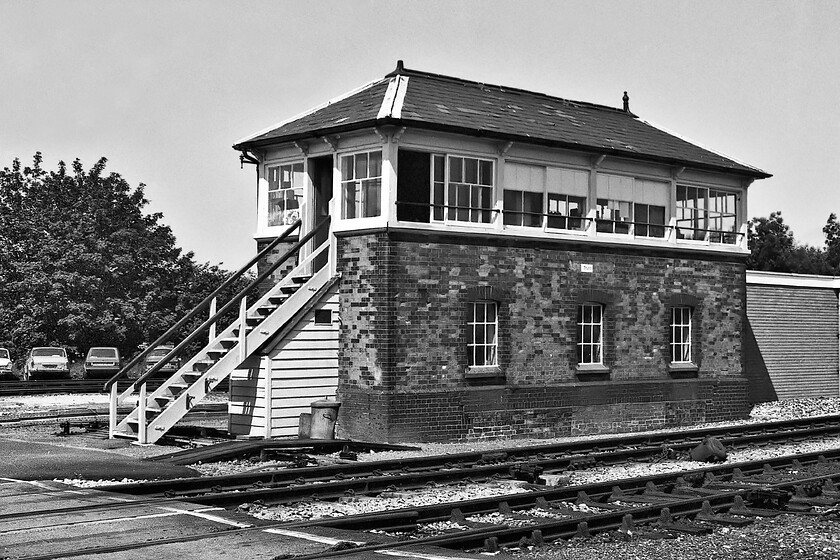 Truro signal box (GWR, 1889) 
 Truro signal box looks superb in the summer sunshine located to the immediate east of the station that was to my left as I took this photograph. The 1889 structure is still in use today but time has been called with the plans to re-signal the entire route west of Plymouth now about to take place. Whilst the box still exists, I suspect that the four 1970s-era cars do not! The lineup includes a Daf 33, a BLMC Landcrab, an early Mk. 1 Golf and a Skoda Estelle. 
 Keywords: Truro signal box GWR 1889