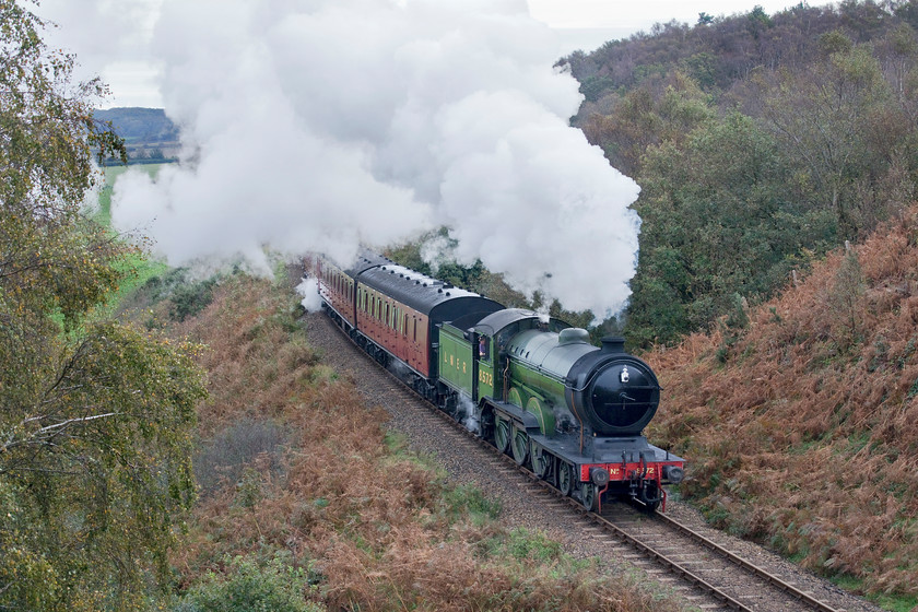 8572, 10.00 Sheringham-Holt, Kelling bank 
 Ex LNER B12 8572 attacks Kelling bank just west of Weybourne as it works the North Norfolk Railway's 10.00 Sheringham to Holt service. This steep climb is a test for many locomotives especially as they are making a standing start from Weybourne station and, for the first section, the line tends to be damp as it passes through a heavily wooded area from which it has just emerged here.

There is an audio recording of this event at my Youtube site, see... https://youtu.be/lLlhjTGUrWs 
 Keywords: 8572 10.00 Sheringham-Holt Kelling bank LNER B12