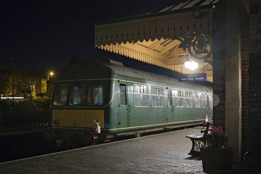 M56352, waiting for the Halloween special, Sheringham station 
 A Class 101 DMU car is seen at Sheringham station. later in the evening and suitably adorned with fake cobwebs and skeletons hanging from the luggage racks, it will work a Halloween Special to Holt and back. Looking at the photgraph now I really should have got to work with Photoshop to 'eliminate' the cone placed between the bench and the train! 
 Keywords: M56352 waiting for the Halloween special Sheringham station