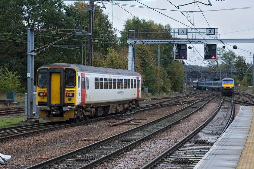 153306, LE 10.58 Norwich-Lowestoft & class 82, LE 11.00 Norwich-London Liverpool Street, Norwich station 
 As the 11.00 to Liverpool Street with a DVT Class 82 at the rear disappears from Norwich 153306 also departs with a far more mundane service, the 10.58 to Lowestoft. Norwich is always a busy station with plenty of coming and going services in all directions. 
 Keywords: 153306 10.58 Norwich-Lowestoft class 82 11.00 Norwich-London Liverpool Street, Norwich station Greater Anglia