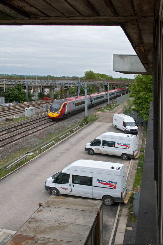 390004, VT 12.30 London Euston-Glasgow Central, from Bletchley PSB 
 The 12.30. Euston to Glasgow Central Virgin West Coast service passes Bletchley worked by 390004. The commanding view is from the former Bletchley power box that closed five months previously but was open for interested visitors on this Saturday afternoon. 
 Keywords: 390004 12.30 London Euston-Glasgow Central from Bletchley PSB