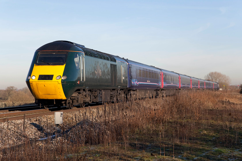 Class 43, GW 13.00 London Paddington-Bristol Temple Meads (1C15), South Marston foot crossing SU196870 
 A newly painted class 43 HST power car leads the 13.00 Paddington to Bristol Temple Meads past South Marston just to the east of Swindon. Despite appearances, I not trespassing but am at a foot crossing that is just a short distance from the busy A420 road. I suspect that this crossing, and the one a short distance behind me will be firmly closed with the forthcoming electrification in-line with Network Rail's current policy. 
 Keywords: Class 43,13.00 London Paddington-Bristol Temple Meads 1C15 South Marston foot crossing SU196870