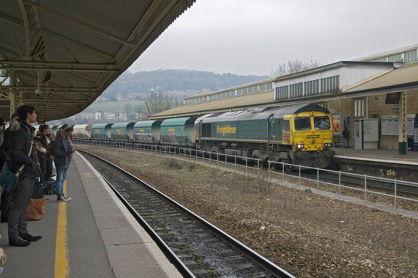 66956, 12.20 Westbury-Hope (Earl's Sidings) (6M36), Bath Spa station 
 As customers wait at Bath Spa station 66956 passes through working the 12.20 Westbury to Hope (Earl's Sidings) empty stone train. The train is composed of a rake of HIA Heavy Haul wagons that are commonly found throughout the country transporting a variety of aggregates. 
 Keywords: 66956 12.20 Westbury-Hope Earl's Sidings 6M36 Bath Spa station