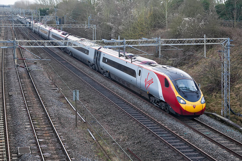 390155, VT 12.55 London Euston-Manchester Piccadilly (1H26, 5L), Victoria Bridge 
 With some weak winter brightness just coming through, 390155 'X-Men: Days of Future Past' heads north past Victoria Bridge with the 12.55 Euston to Manchester Piccadilly. This Pendolino was named on 31st March 2014 at Euston to promote the film of the same name, quite why the name has remained on the train I am unsure? 
 Keywords: 390155 12.55 London Euston-Manchester Piccadilly 1H26 Victoria Bridge