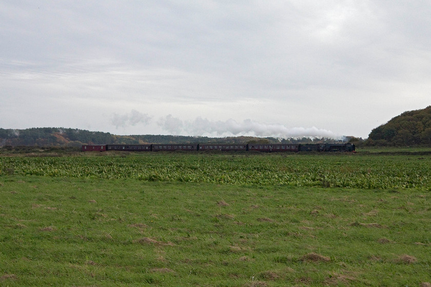 92203, 15.30 Sheringham-Holt, Dead Mans Hill TG135434 
 After leaving my wife and son in Sheringham playing in the amusement arcades, I walked back to Kelling to get the car. On my walk back, 92203 'Black Prince' is seen leading the 15.30 Sheringham to Holt past Dead Man's Hill just west of Sheringham. It's shame that the sun was not out, it makes this image too flat and lifeless but at least the trail of exhaust livens it it up a bit! 
 Keywords: 92203 15.30 Sheringham-Holt Dead Mans Hill TG135434