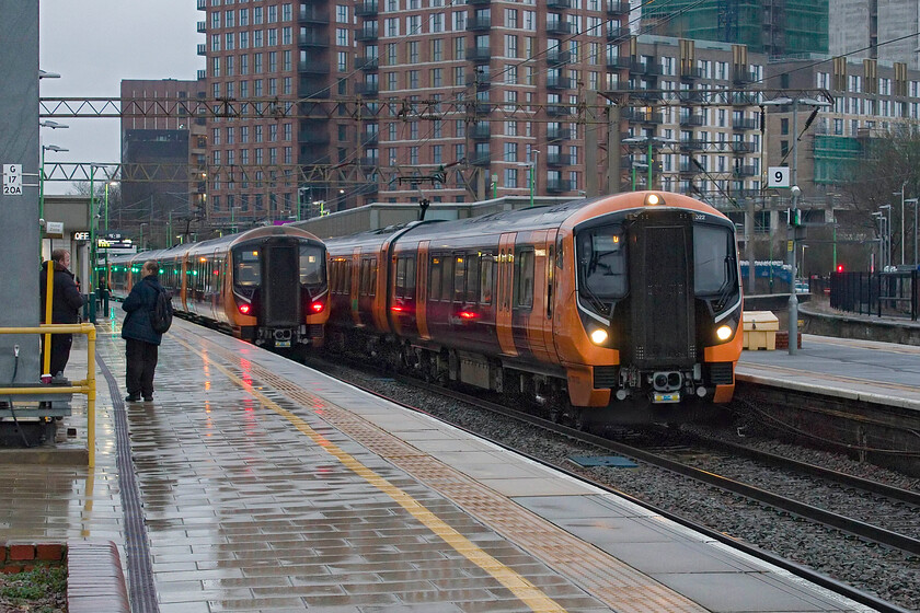 730018, LN 16.39 London Euston-Milton Keynes Central (2K45, RT) & 730022, LN 16.41 Tring-London Euston (2T50, RT), Watford Junction station 
 On the very southern section of the West Coast Mainline the Class 730 takeover is taking shape. They have been in regular service for over a year now on local stopper services, but do not go any further than Milton Keynes. To the left, 730018 is working the 16.39 Euston to Milton Keynes whilst to the right 730022 is departing with the 16.41 Tring to Euston service. 
 Keywords: 730018 16.39 London Euston-Milton Keynes Central 2K45 730022 16.41 Tring-London Euston 2T50 Watford Junction station London Northwester West Midlands Trains