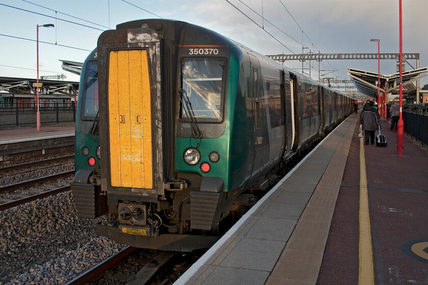 350370 & 350404, LN 18.14 Birmingham New Street-Northampton (terminated at Rugby) (2T04, 6L), Rugby station 
 After what had been a perfect journey from Frome with every train being on time things had all of a sudden gone horribly wrong on arrival at Rugby! Our train worked by 350370 and 350404, the 18.14 Birmingham New Street to Northampton 'stopper', was put into Rugby's platform one and promptly terminated. Due to a signalling failure somewhere near Long Buckby, all lines were closed so passengers had to disembark and completed thier journey on a coach travelling via the M1 to junction sixteen. Luckily the traffic flowed well and arrival in Northampton was only some twenty five minutes later than timetabled. 
 Keywords: 350370 350404 18.14 Birmingham New Street-Northampton Rugby 2T04 Rugby station London NorthWestern Desiro