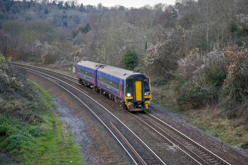 158958, GW 12.50 Great Malvern-Weymouth (2O90), Freshford station 
 Taken from Freshford's station footbridge 158958 approaches working the 12.50 Great Malvern to Weymouth train. The line from Bathampton Junction to Bradford-on-Avon follows deeply wooded and gently curving Avon Valley with the Kennet and Avon canal and the A36 trunk road cheek by jowl for most of its length. 
 Keywords: 158958 12.50 Great Malvern-Weymouth 2O90 Freshford station FGW First Great Western