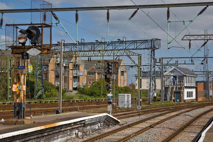 Searchlight up starter gantry & Clacton-on-Sea signal box (GE, 1891), Clacton-on-Sea station 
 The signalman stands at the top of the signal box steps taking in some welcome spring sunshine at Clacton-on-Sea. Whilst he will control colour light C60, a more conventional signal type, he will also control vintage 'searchlight' type C55. This mix of signalling at Clacton is a delight to behold but is scheduled to be replaced in the coming few years with the associated box to be swapped away in the name of progress. 
 Keywords: Searchlight up starter gantry Clacton-on-Sea signal box 1891 Clacton-on-Sea station GER Great Eastern Railway