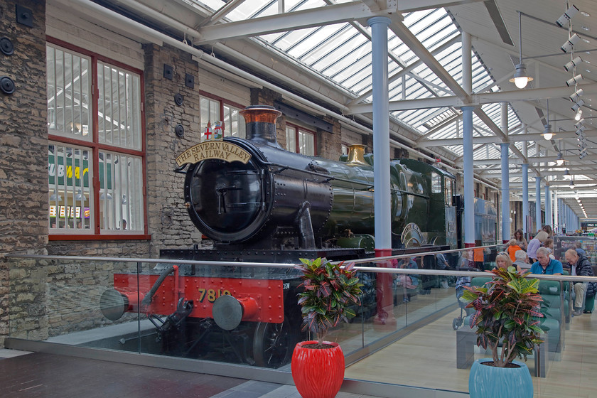 7819, on display, Swindon Outlet Village 
 One of Swindon's locomotives sits proudly on display inside the Swindon outlet village. Collett designed 7819 'Hinton Manor' was built at Swindon by the GWR in 1938. It was withdrawn in 1965 and ended up at Barry. It was rescued in 1973 and was taken to the Severn Valley Railway where it was restored. It saw extensive use on the mainline and preserved lines and was one of the engines used as part of the GWR 150 celebrations in 1985 when it was painted in British Railways black. A few weeks after this picture was taken, 7819 was moved back to the SVR. 
 Keywords: 7819 Swindon Outlet Village