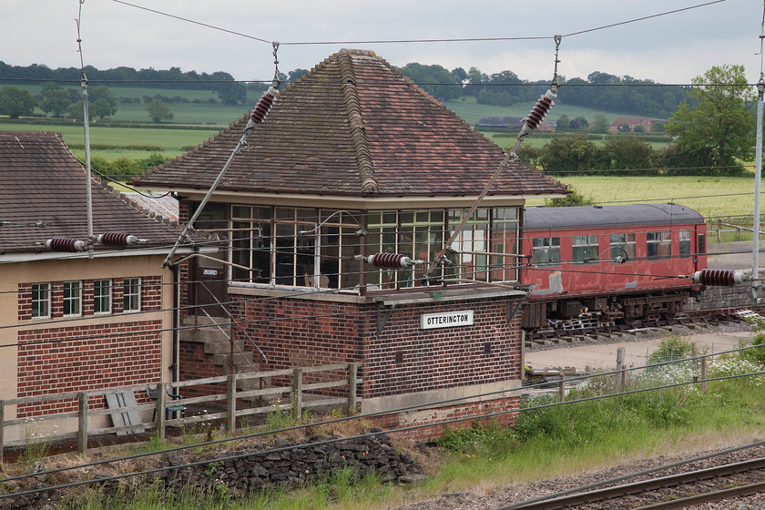 Otterington signal box (LNER, 1933) (Preserved) 
 The preserved Otterington signal box next to the ECML. The station building to the left and the box were built by the LNER in 1932 when the lines were quadrupled necessitating the demolition of the original station. Allegedly the box contains a fully operational frame but this is from another closed box. The station, box and weigh bridge house are all Grade two listed, see..... https://www.bbc.co.uk/news/uk-england-46618992 
 Keywords: Otterington signal box