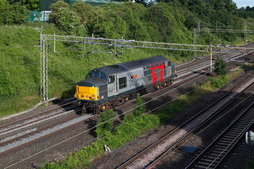 37611, 05.29 Leicester-Northampton EMD LE (Via Weedon Loop, reverse at CMK),Victoria Bridge 
 This is not a sight that is seen very often! Rail Operations Group 37611 'Pegasus' runs on the up fast line past Victoria Bridge in Northamptonshire. This is the 05.29 Leicester to Northampton EMD light engine movement in order to collect a London Northwestern class 350 to take it to Long Marston. However, because the Northampton line was closed north of the town, this move came along the Weedon Loop as far as Milton Keynes where it reversed. 
 Keywords: 37611 05.29 Leicester-Northampton EMD LE Victoria Bridge