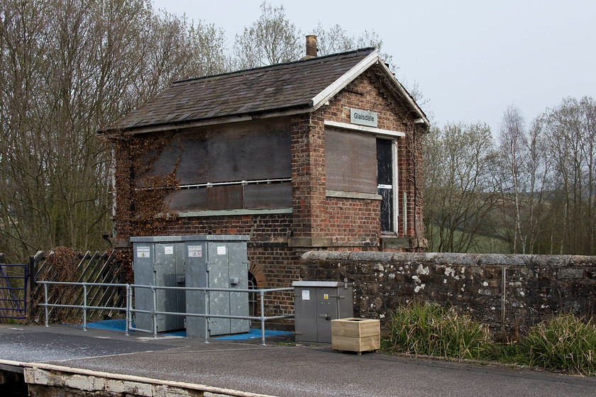 Glaisdale signal box (Closed) (NER, 1902) 
 When I last travelled on the Esk Valley line in 1980, Glaisdale signal box was open and staffed. Indeed, I took a very similar picture to this from the class 101 DMU that I was travelling on, see......https://www.ontheupfast.com/p/21936chg/29786100004/x1-glaisdale-signal-box-ner-1902 Today, the trees have grown up behind it, the ivy is encroaching but it still has its BR corporate nameplate and private sign on the door. It's a shame that the 1904 constructed North Eastern Railway box could not be put to some sort of community use, but, having said that, the station is a little remote being some distance from the village of Glaisdale. Incidentally, Barbara Streisand singing 'Woman in Love' was number one when I last visited, this time it was somebody called Lewis Capaldi singing 'Someone Loved you'; apparantly! 
 Keywords: Glaisdale signal box