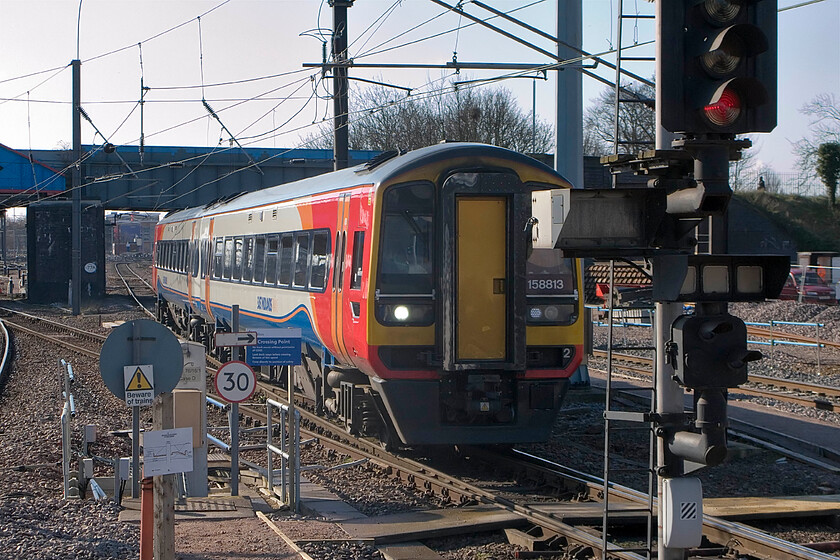 158813, EM 07.57 Norwich-Liverpool Lime Street, Peterborough station 
 158813 negotiates its entry into Peterborough station from the south working East Midlands Trains' 07.57 Norwich to Liverpool Lime Street service. This image amply illustrates the rather cluttered scene at this end of the station some of which is associated with its extensive remodelling and extension. 
 Keywords: 158813 07.57 Norwich-Liverpool Lime Street Peterborough station EMT East Midlands Trains