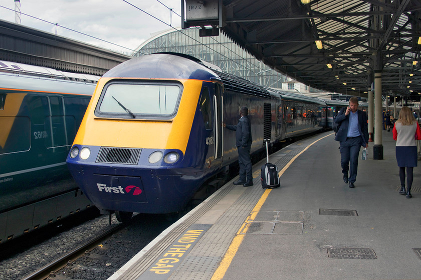 43162, GW 13.03 London Paddington-Plymouth (1C82, 5L), London Paddington station 
 With staff exchanging a few final words, 43162 'Exeter Panel Signal Box 21st Anniversary 2009' is about to lead the 13.03 to Plymouth out of Paddington at the start of its journey westwards. There were a few enthusiasts on the platform end to witness this departure, of which there will be very few left now with HSTs to be finally withdrawn from the western routes in the next two weeks. 
 Keywords: 43162 13.03 London Paddington-Plymouth 1C82 London Paddington station