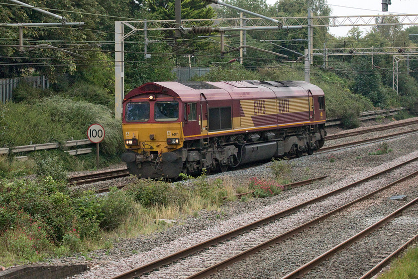 66171, 07.05 Dollands Moor-DIRFT LE (0M45, 3L), site of Castlethorpe station 
 66171 is not a Class 66 that I photograph very often. In fact, the last time I pictured it working a train was back in 2014. Here it passes light engine through Castlethorpe just south of Hanslope Junction as the 07.05 Dollands Moor to Daventry. Light engine movements in and out of the Daventry Rail Freight Terminal are not that common. With thanks to Mike for the reporting number. 
 Keywords: 66171 07.05 Dollands Moor-DIRFT LE 0M45 site of Castlethorpe station EWS DB