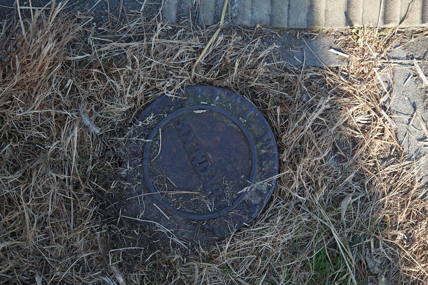 GWR boundary marker, Rhoose station 
 If you walk around with your head facing the ground on GW territory, you will come across boundary markers. This particular example was adjacent to the level crossing and up platform at Rhoose station. 
 Keywords: GWR boundary marker Rhoose station