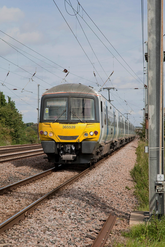 365539 & 365505, GN 10.46 Peterborough-London Kings Cross (1P59, 2L), Holme Green Crossing TL192426 
 Just as the sun comes out Andy and me head for home! The last train of the day for us is 365539 and 365505 forming the 10.46 Peterborough to King's Cross as it passes Holme Green farm crossing. The picture is taken from a perfectly safe and legal position behind a fence at the crossing; I hope that the driver saw it the same way from his perspective. 
 Keywords: 365539 365505 1P59 Holme Green Crossing TL192426