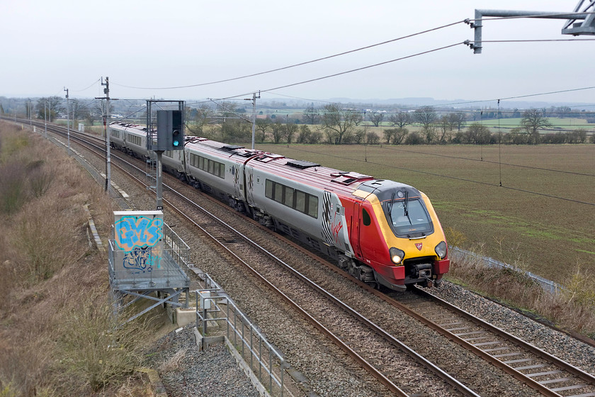 221113, VT 11.28 Chester-London Euston (1A19), Milton crossing 
 The 11.28 Chester to London Euston has one more stop at Milton Keynes before arriving in the capital seen here approaching Roade cutting at Milton Crossing. I suspect that many passengers aboard the Virgin Trains Voyager will be relieved to arrive as I am sure that they find these particularly poor trains as noisy and uncomfortable as I do! 
 Keywords: 221113 VTWC 11.28 Chester-London Euston 1A19 Milton crossing Virgin Trains Voyager