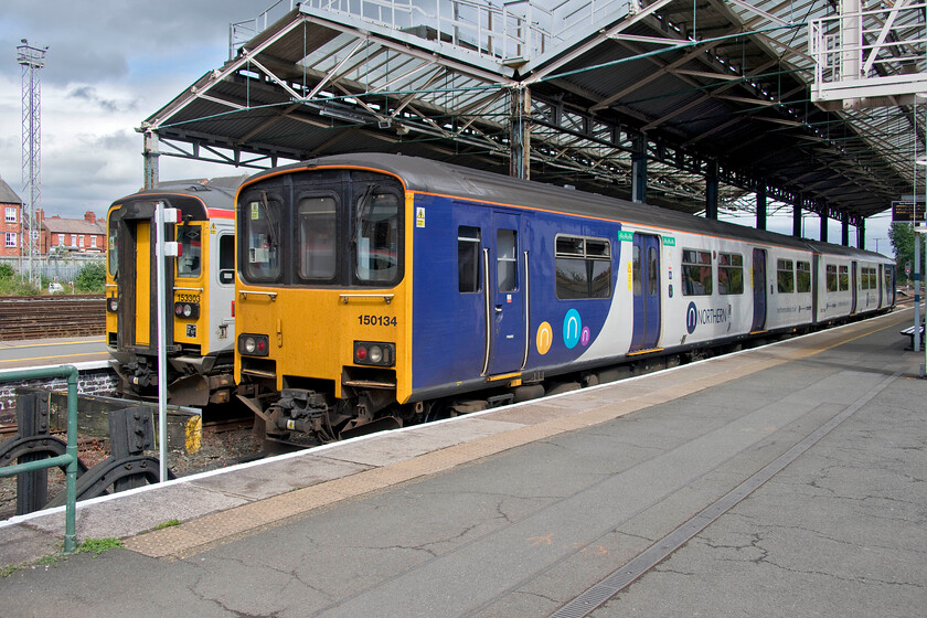 153303, NT 16.30 Chester-Liverpool Lime Street (1B00, RT) & 150134, NT 17.02 Chester-Manchester Piccadilly (2H33, RT), Chester station 
 Up for imminent replacement.

Both 153303 and 150134 should be replaced by new units in the coming couple of years but invertible delays have pushed this back a little. To the left 153303 will soon leave with the 16.30 service to Liverpool Lime Street via Helsby and the Halton curve (Runcorn). These trains offer an alternative route to Liverpool rather than going via the Wirral with Merseyrail. They also offer passengers from Chesire a direct route to Liverpool's John Lennon Airport. To the right, 150134 will work the 2H33 service to Manchester Piccadilly via Norwich and Knutsford. 
 Keywords: 153303 16.30 Chester-Liverpool Lime Street 1B00 150134 17.02 Chester-Manchester Piccadilly 2H33 Chester station Northern