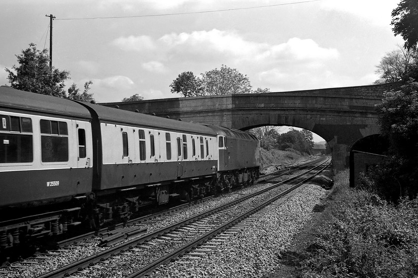 Class 47, unidentified Portsmouth Harbour working, Bathampton ST769662 
 Taken by standing (quite illegally it has to be said!) on the base of the old Bathampton West signal box a class 47 takes a Portsmouth Harbour train along the GWML towards Bathampton Junction. In about a mile or so, the train will take the Avon Valley line off to the south. Notice the large area of white paint on the bridge that was used to aid sighting of some semaphores that would have been placed just in front of it. Looking at the size of the painted area, I suspect that it would have been a bracket signal protecting the up main and the loop that is just off to the left. 
 Keywords: Class 47 Portsmouth Harbour working Bathampton ST769662