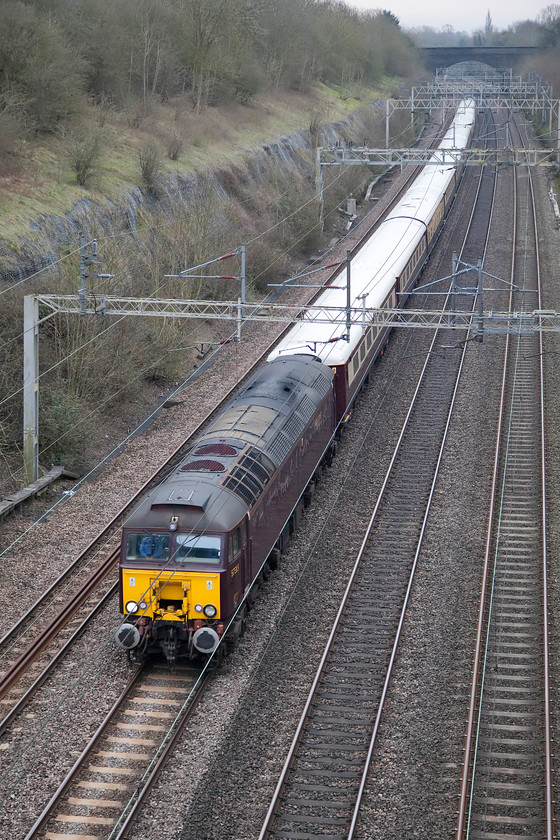 57313, 06.47 London Euston-Liverpool Lime Street (1Z59), Roade Cutting 
 The first of two specials to pass through Roade Cutting in connection with the Grand National at Aintree. Here, 57313 (formally 47371) leads the 06.47 London Euston to Liverpool Lime Street running as 1Z59. The stock is the very smart Northern Belle Mk. 11s, I suspect that the race-goers would be well looked after! 
 Keywords: 57313 06.47 London Euston-Liverpool Lime Street 1Z59 Roade Cutting