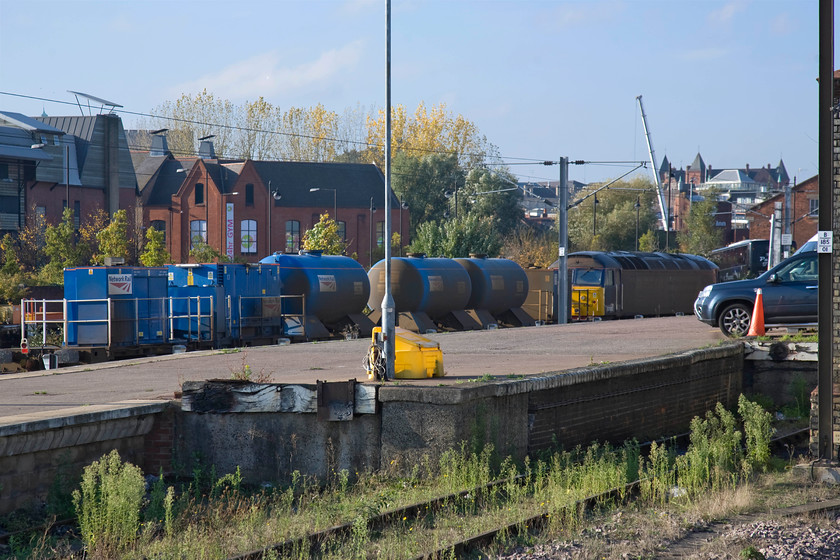 57002, stabled RHTT, Norwich station 
 In between duties, a railhead treatment train stands idle in Norwich's station yard with a characteristically dirty 57002 at the front. These trains see heavy use at this time of year and they always operate in top and tail mode so I suspect that it has been sidelined due to an issue with the trailing locomotive as it appears to be absent. 
 Keywords: 57002 stabled RHTT Norwich station