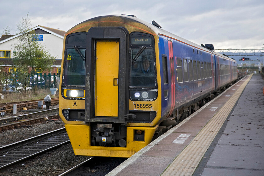 158955, 11.33 Cheltenham-Brighton (1O98), Gloucester station 
 What should have been the penultimate train of our journey from Northampton to Bristol's Stapleton Road arrives at Gloucester station. I say that it should have been as we arrived rather late into Temple Meads thus missing the Severn Beach service that would have taken us to our destination. As a result, we took a rather expensive taxi from Temple Meads to Easton where I was picking up the car. 158955 coasts into platform one at Gloucester working the 1O98 11.33 Cheltenham to Brighton FGW service. 
 Keywords: 158955 11.33 Cheltenham-Brighton 1O98 Gloucester station FGW First Great Western