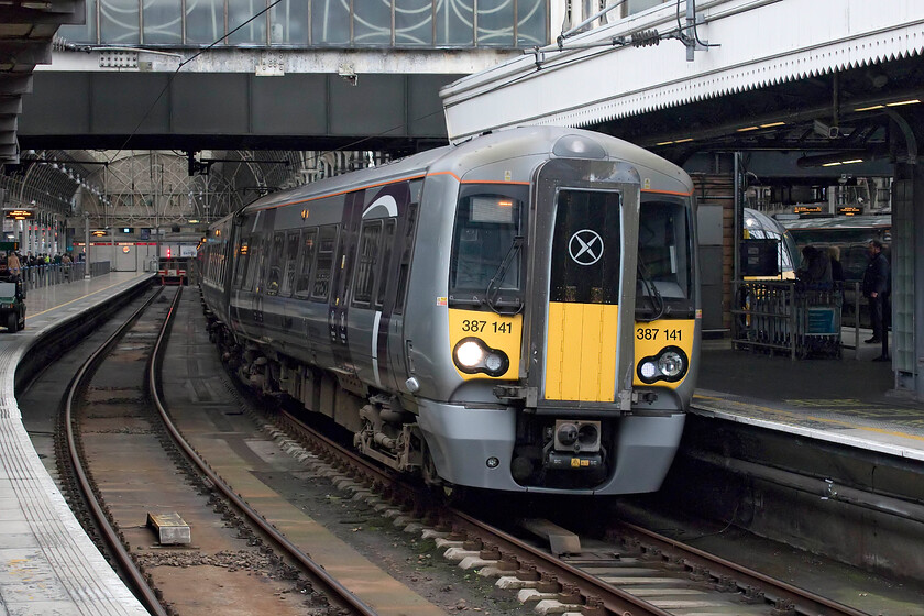 387141, HX 14.10 London Paddington-Heathrow Airport T5 (1T60, RT), London Paddington station 
 On arrival at Paddington station, I managed a photograph of one of Heathrow Express' twelve Electrostars leaving with the 14.10 service to the airport's terminal five. These units entered service two years ago replacing the relatively new Class 332s that, unbelievably, went for scrap! 
 Keywords: 387141 14.10 London Paddington-Heathrow Airport T5 1T60 London Paddington station Heathrow Express