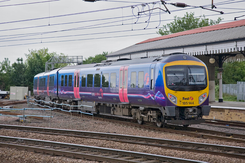 185144, TP 14.22 Liverpool Lime Street-Scarborough (1E88), York station 
 185144 accelerates away from York station working the 1E88 14.22 Liverpool to Scarborough train. It has just completed quite a complicated move that saw it crossing the main running lines to the north of the station from platform five (the former platform eight) in order to make its way out towards the coast and Scarborough. 
 Keywords: 185144 14.22 Liverpool Lime Street-Scarborough 1E88 York station TPE TransPennine Express