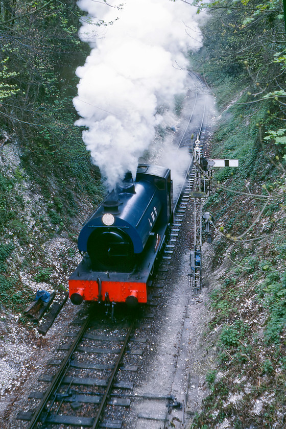 196, running round, Sun Lane New Alresford 
 196 'Errol Lonsdale' runs round and this image was taken from the lofty heights of Sun Lane in New Alresford. This powerful little 0-6-0 tank locomotive was built by Hunslet in Leeds to the LNER J94 design. However, 196 never worked on the mainline being built for the Ministry of Defence for use on its Longmoor Military Railway a short distance from the locomotive's present location on the Watercress Line. 
 Keywords: 196 Sun Lane New Alresford Errol Lonsdale