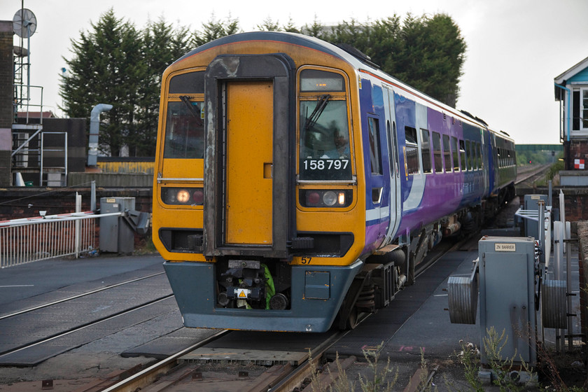 158797, NT 16.30 Sheffield-Hull (2R75, 4L), Goole station 
 Northern's 158797 arrives at Goole station working the 16.30 Sheffield to Hull. The train is just crossing the level crossing that crosses Goole's Boothferry Road and causes so much congestion when the barriers are lowered. 
 Keywords: 158797 2R75 Goole station