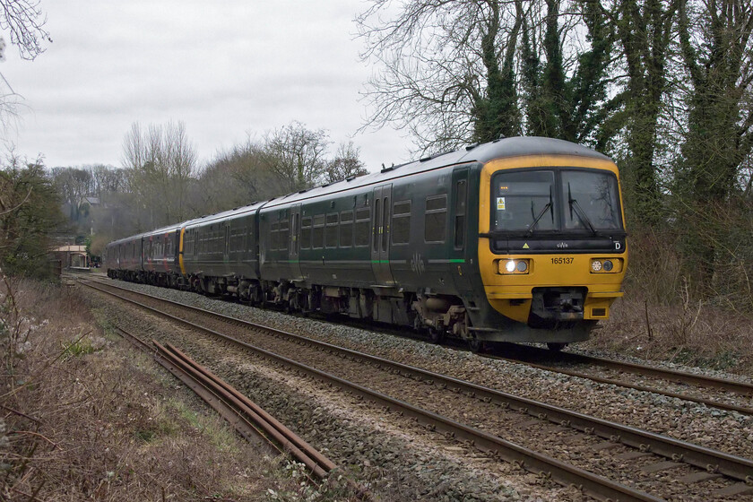 165137 & 166202, GW 09.40 Westbury-Worcester Foregate Street (2E59, 11L), BOA no. 1 crossing ST822605 
 Former Thames Valley Turbos 165137 and 166202 pick up speed on departure from Bradford-on-Avon station that can be just seen in the distance. The units are working the 09.40 Westbury to Worcester Foregate Street GWR service. This was a favourite spot of mine as a young spotter some forty-five years ago and it always feels very strange when I return recalling my juvenile spotting activity! 
 Keywords: 165137 166202 09.40 Westbury-Worcester Foregate Street 2E59 Bradford-on-Avon no. 1 crossing ST822605 Great western Railway GWR Turbo