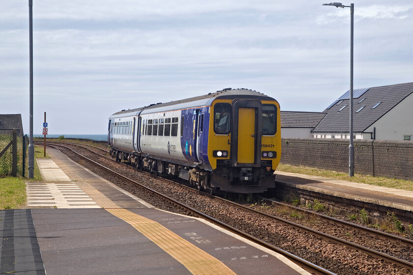 156421, NT 10.14 Lancaster-Carlisle (2C51, 2L), Parton station 
 Northern's 10.14 Lancaster to Carlisle service arrives at Parton station worked by 156421. Not every train stops at Parton station but the small village just north of Whitehaven enjoys a regular stopping pattern. 
 Keywords: 156421 10.14 Lancaster-Carlisle 2C51 Parton station Northern