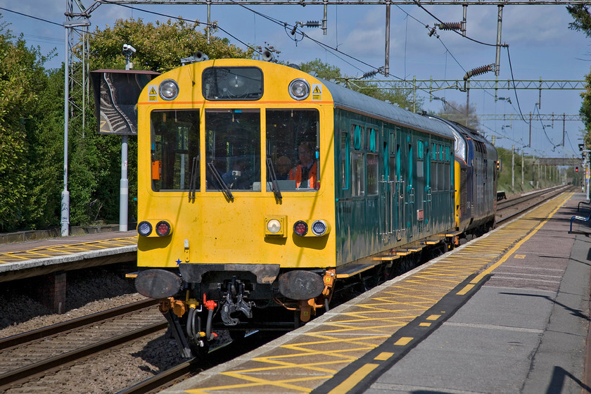 975025 'Caroline' & 37402, 07.25 Willesden-Willesden (via Cambridge & Ipswich), Hatfield Peverel station 
 Having seen the Network Rail observation train a little earlier at Witham station we looked at RTT and worked out where we would be able to see it working. We judged this to be at Hatfield Peverel and we calculated correctly. With 37402 'Stephen Middlemore 23.12.1954-8.6.2013' powering at the rear former Class 203 coach S60755 now numbered 975025 'Caroline' races through the station returning to Willesden where it had left earlier in the day at 07.25 travelling out via Cambridge and Ipswich. 
 Keywords: 975025 Caroline 37402 07.25 Willesden-Willesden via Cambridge & Ipswich Hatfield Peverel station Stephen Middlemore 23.12.1954-8.6.2013