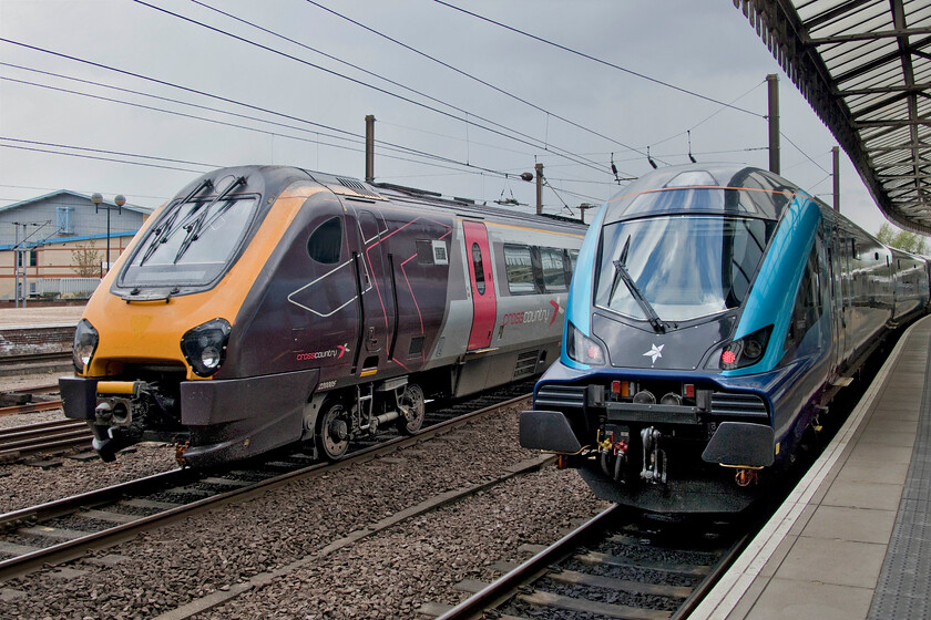 220005, XC 10.35 Newcastle-Banbury (1V87, RT) & NOVA3 DVT, TP 12.00 York-Scarborough (1T31, RT), York station 
 With storm clouds gathering that were about to deposit a mixture of rain, sleet and hail on York 220005 arrives with the 10.35 Newcastle to Banbury CrossCountry service. To its left the rear of the TPE 12.00 shuttle departure to Scarborough is seen with an unidentified NOVA3 DVT at the rear. Out of sight on the front was 68020 'Reliance'. 
 Keywords: 220005 10.35 Newcastle-Banbury 1V87 NOVA3 DVT 12.00 York-Scarborough 1T31 York station CrossCountry Voyager TPE TransPennine Express