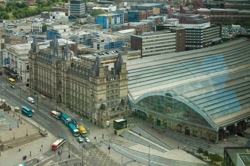 Liverpool Lime Street station from St. John`s Beacon 
 Taken from the dizzy heights of the St. John's Beacon tower that dominates Liverpool's city centre, Lime Street station is seen from this elevated position. The two train sheds look to be in good condition with the station having undergone a series of restoration works over recent years. Also dominating the scene is the North Western hotel, built in the Renaissance Revival style resembling a French chteau. Beyond the hotel is the portland stone-faced Liverpool Empire theatre built in 1925 to a free Neoclassical classical style. Both buildings are Grade II listed along with the station itself. 
 Keywords: Liverpool Lime Street station from St. John`s Beacon