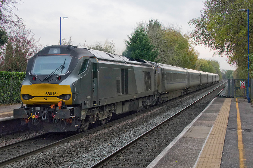 68015, CH 13.55 Birmingham Moor Street-London Marylebone (1H48, 1L), Lapworth station 
 68015 powers the rear of the 13.55 Birmingham Moor Street to London Marylebone 'Mainline' service. The train is seen passing through Lapworth station just south of Dorridge. These locomotives are particularly noisy and we could here it for sometime after it had passed heading south towards Hatton North Junction. 
 Keywords: 68015 13.55 Birmingham Moor Street-London Marylebone 1H48 Lapworth station