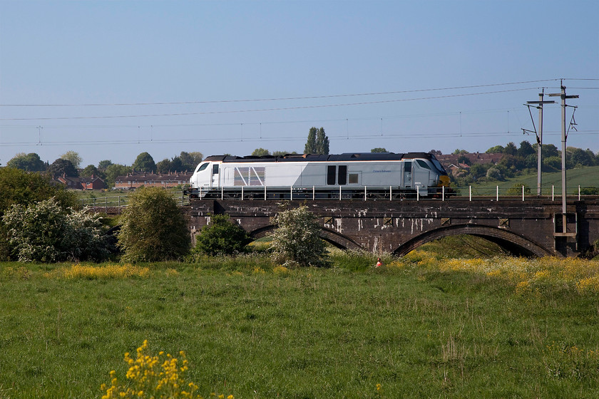 68015, 06.50 Crewe Gresty Bridge-Wembley LE, Kingsthorpe Meadow 
 68015, running under caution, eases past the lush meadows near to Kingsthorpoe to the north of Northampton. It was running as the 06.50 Crewe Gresty Bridge to Wembley light engine move. 
 Keywords: 68015 06.50 Crewe Gresty Bridge-Wembley Kingsthorpe Meadow